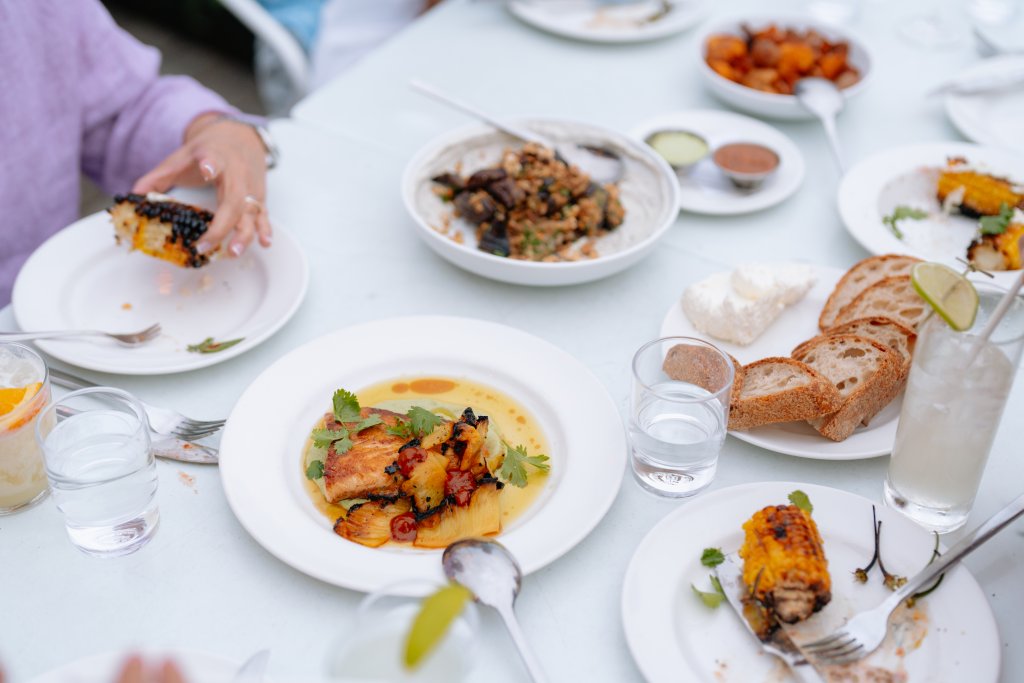 A family shares a meal of sustainable seafood at Westward in Seattle. 