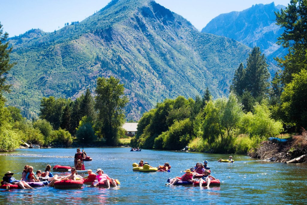 Photo of people floating in tubes on a river