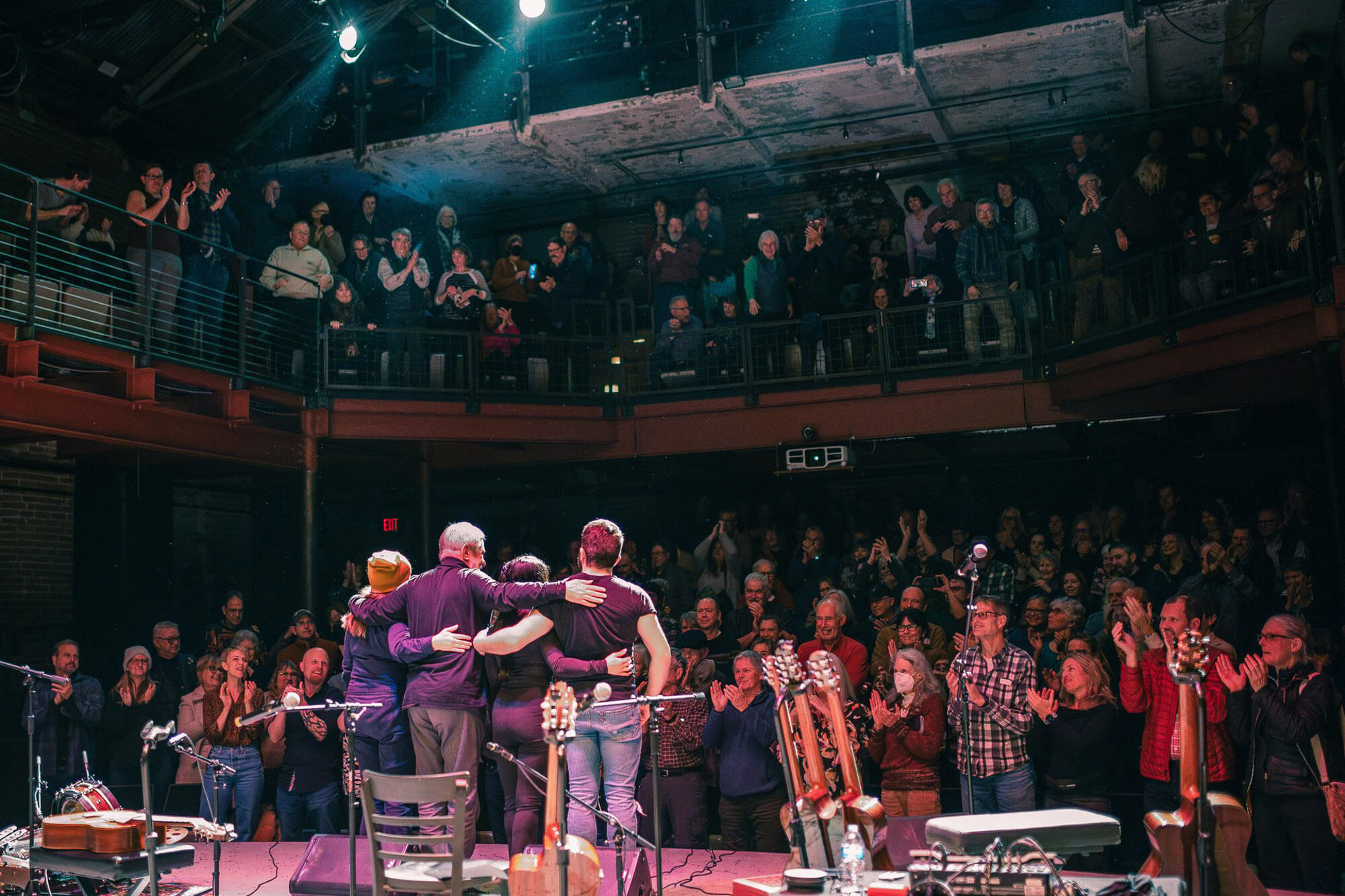 The audience cheers as performers stand on stage at one of Washington theaters 