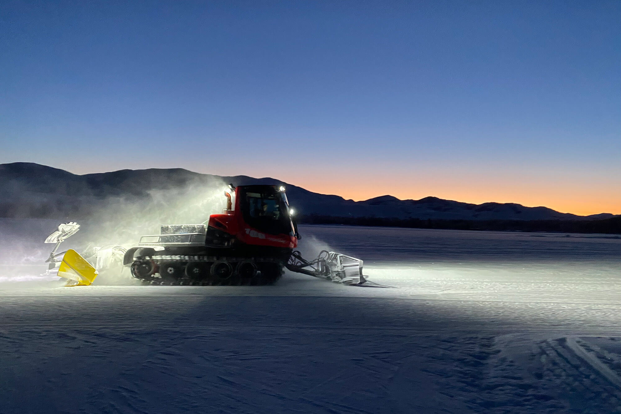A machine grooms the Methow Trails cross-country ski system in the evening 