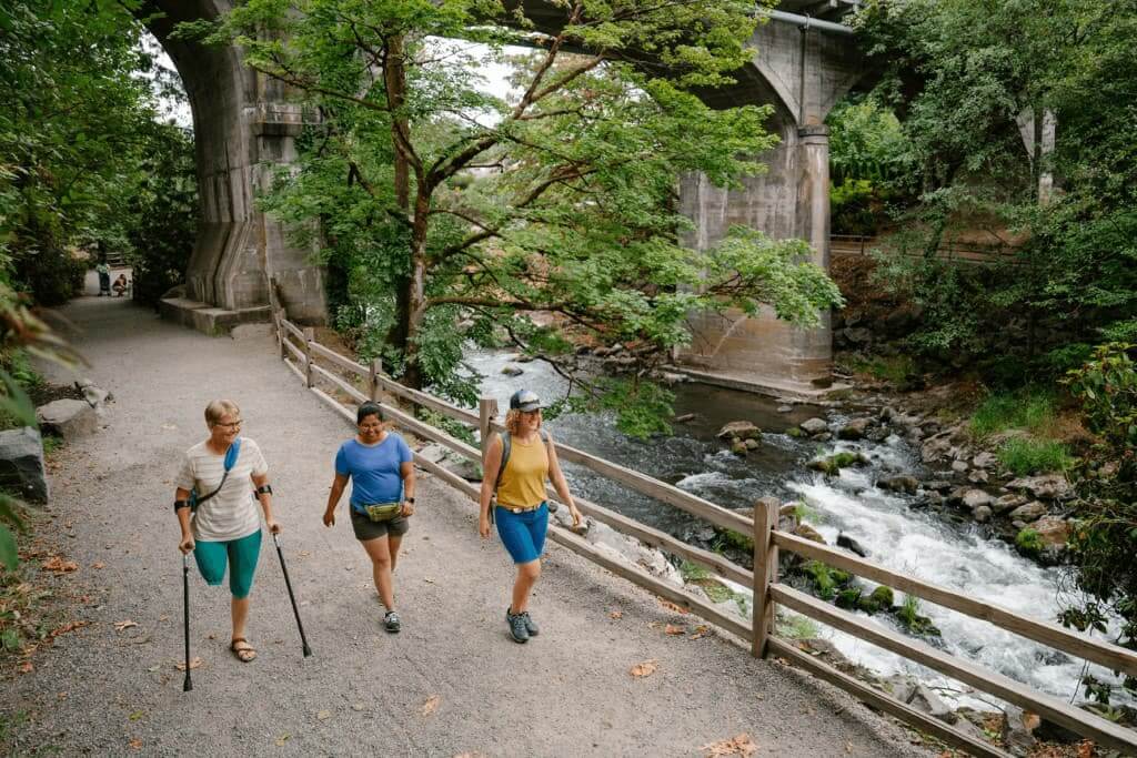 Friends walking in Brewery Park in Turnwater Falls.
