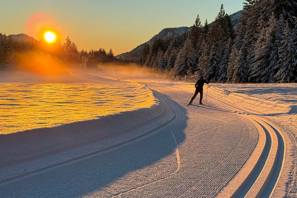 A man cross-country skis at Sunset in the Methow Trails 