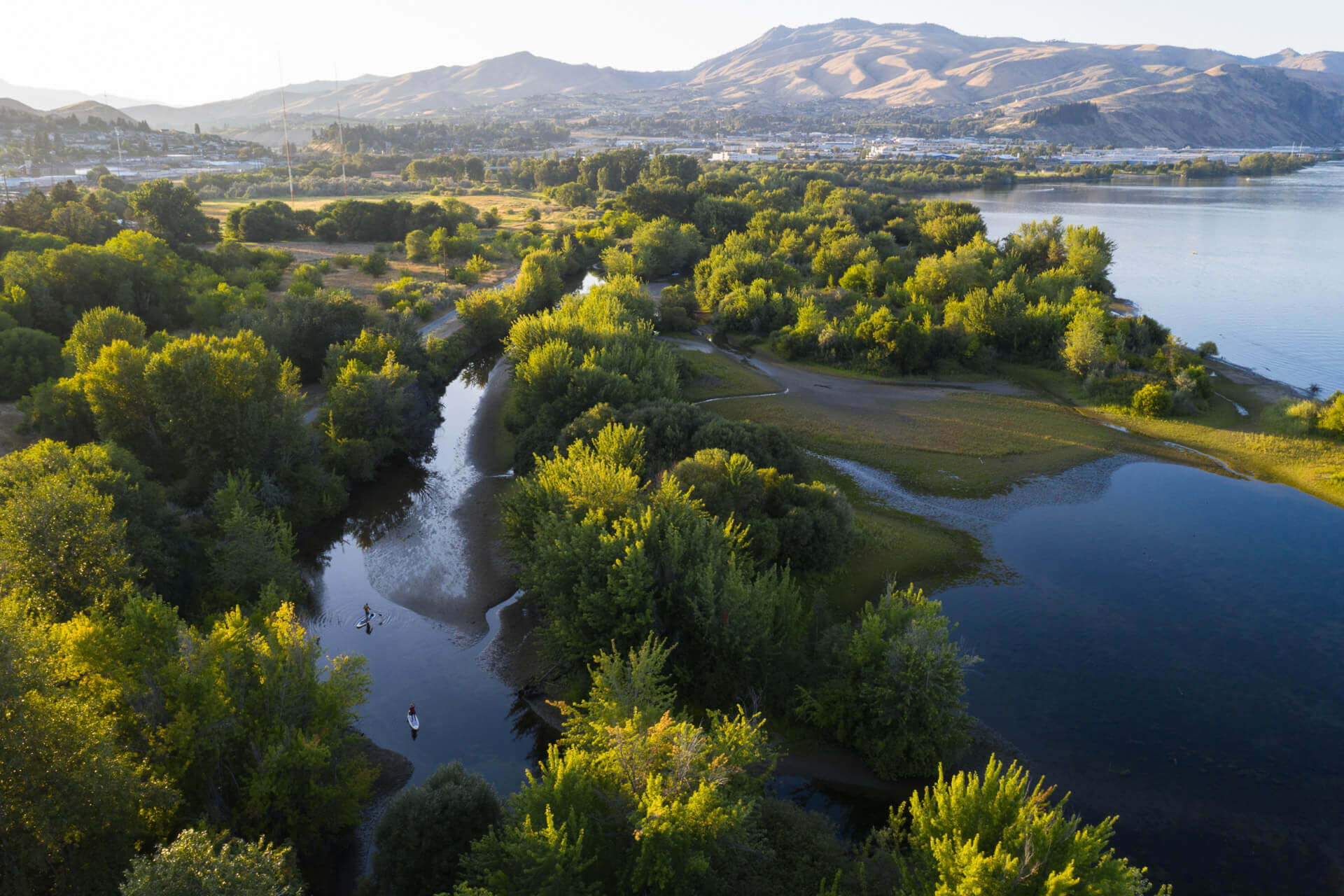 A aerial view of the Columbia River and trees in Wenatchee.