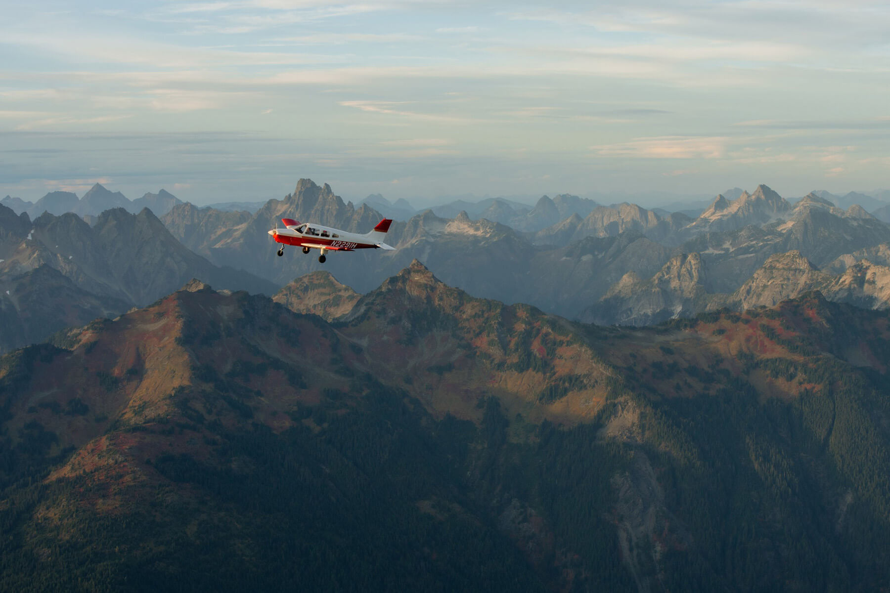 Small airplane flying over Washington State. 