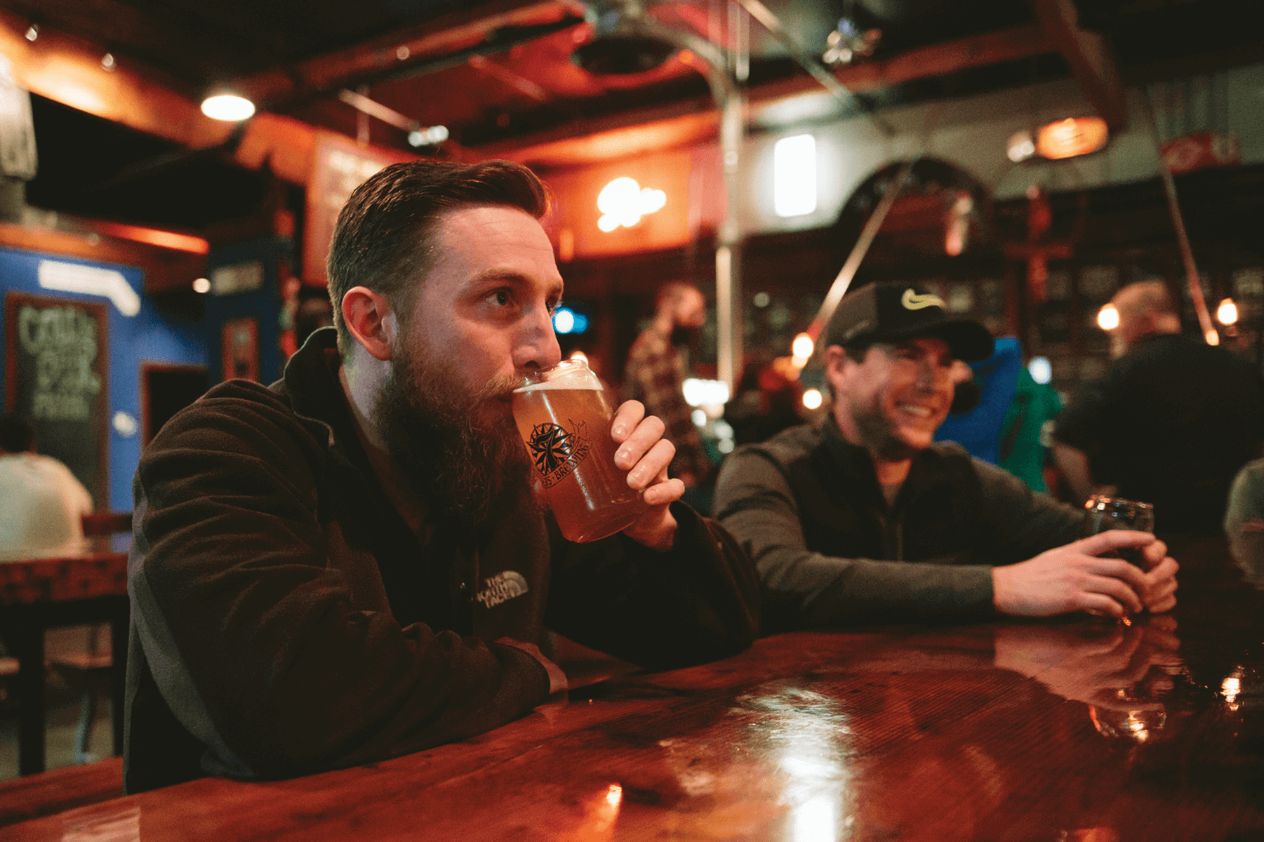 Friends drinking beer at 7 Seas Brewery in Tacoma. 